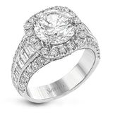 This show-stopping halo design contains .88 ctw of round diamonds along with a whopping 1.03 ctw of baguette cut diamonds.