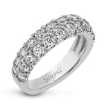 Simple yet elegant, this understated white gold band sparkles with 1.57 ctw of round white diamonds