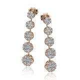These lovely floral earrings have a touch of 60s inspired vintage feeling, with an astounding 3.06 ctw of white diamonds.