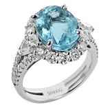 This stunning  right hand ring features a 6.09 ctw sapphire center, surrounded by 1.06 ctw of round brilliant diamonds, and 2 pear shaped diamonds 0.60 cttw.