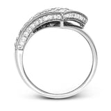 This modern overlapping ring features an expanse of 2.89 ctw of Simon-set princess cut diamonds accented by .27 ctw of round diamonds in 18k white gold.
