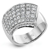This modern overlapping ring features an expanse of 2.89 ctw of Simon-set princess cut diamonds accented by .27 ctw of round diamonds in 18k white gold.
