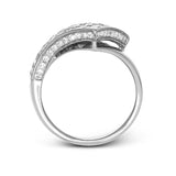 This modern overlapping ring features an expanse of 2.89 ctw of Simon-set princess cut diamonds accented by .27 ctw of round diamonds in 18k white gold.
