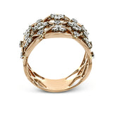 This unique rose gold band's striking openwork is accentuated by accents of white gold and .65 ctw of round white diamonds