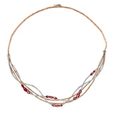 Delicate tendrils of two-tone gold sparkle with 1.44 ctw of white diamonds and 3.45 ctw of emeralds in this modern, nature-inspired necklace
