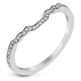 This lovely contemporary design features white gold and .16 ctw of round white diamonds and .39 ctw of oval shaped white diamonds as well as delicate milgrain edging around its centerpiece.