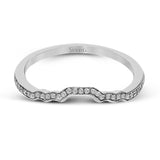 This lovely contemporary design features white gold and .16 ctw of round white diamonds and .39 ctw of oval shaped white diamonds as well as delicate milgrain edging around its centerpiece.