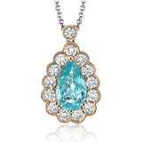 This gorgeous white gold pendant features a halo of .46 ctw of round white diamonds highlighting a beautiful .80 ctw pear shaped paraiba tourmaline.