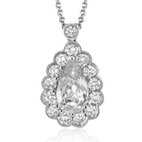 This gorgeous white gold pendant features a halo of .46 ctw of round white diamonds highlighting a beautiful .80 ctw pear shaped paraiba tourmaline.