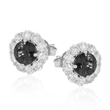 These lovely, vintage-inspired white gold earrings feature 1.15 ctw of sapphires framed by halos containing 1.17 ctw of round white diamonds.