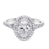 This beautiful, classic style setting features a double halo design built for an oval center stone. It contains .40 ctw of side diamonds.