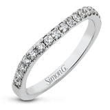 This beautiful, classic style setting features a double halo design built for an oval center stone. It contains .40 ctw of side diamonds.