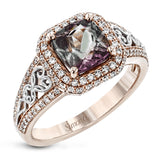 This remarkable white and rose gold ring features an eye-catching 2.56 ctw cushion cut watermelon tourmaline supported by .48 ctw of round white diamonds and a delicate openwork design.