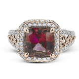 This remarkable white and rose gold ring features an eye-catching 2.56 ctw cushion cut watermelon tourmaline supported by .48 ctw of round white diamonds and a delicate openwork design.