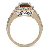 This remarkable white and rose gold ring features an eye-catching 2.56 ctw cushion cut watermelon tourmaline supported by .48 ctw of round white diamonds and a delicate openwork design.