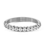 This classic wedding band contains a stunning .50 ctw of white round diamonds