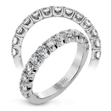 This classic wedding band contains a stunning 1.00 ctw of white round diamonds