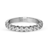 This classic wedding band contains a stunning 1.00 ctw of white round diamonds