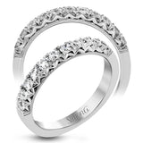 This classic wedding band features a distinctive setting style that shows off the .50 ctw of white diamonds to their full advantage.