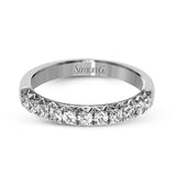 This classic wedding band features a distinctive setting style that shows off the .50 ctw of white diamonds to their full advantage.