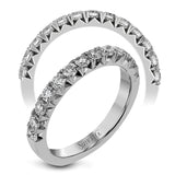 This band pairs perfectly with an engagement ring, or can be worn on its own or stacked with other rings. It contains .75 ctw of white diamonds.