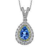 This elegant, vintage-inspired pendant glimmers with .28 ctw of round white diamonds and a .72 ctw pear shaped emerald, all set in sophisticated two-tone gold.
