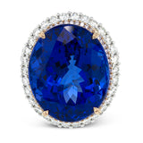 Opulent and glamorous, this white and rose gold ring features a jaw-dropping 28.60 ctw oval shaped tanzanite ringed by a double halo and a total of 1.80 ctw of round white diamond accents.