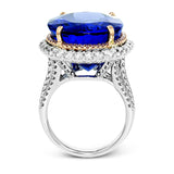 Opulent and glamorous, this white and rose gold ring features a jaw-dropping 28.60 ctw oval shaped tanzanite ringed by a double halo and a total of 1.80 ctw of round white diamond accents.
