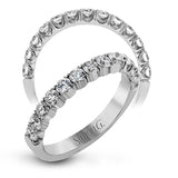 This classic wedding band contains a stunning .75 ctw of white round diamonds