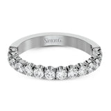 This classic wedding band contains a stunning .75 ctw of white round diamonds