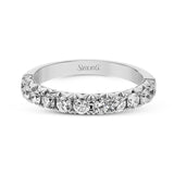 This classic wedding band features a distinctive setting style that shows off the .75 ctw of white diamonds to their full advantage.