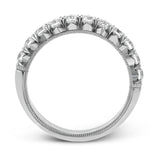 This classic wedding band features a distinctive setting style that shows off the .75 ctw of white diamonds to their full advantage.