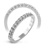 This classic wedding band features a distinctive setting style that shows off the .35 ctw of white diamonds to their full advantage.