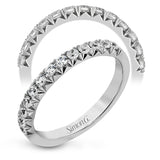 This band pairs perfectly with an engagement ring, or can be worn on its own or stacked with other rings. It contains .50 ctw of white diamonds.