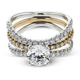 This distinctive bridal set design features a double-layer wedding band that fits around the engagement ring. The set contains .77 ctw of white diamonds.