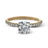 This distinctive bridal set design features a double-layer wedding band that fits around the engagement ring. The set contains .77 ctw of white diamonds.