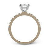 This distinctive bridal set design features a double-layer wedding band that fits around the engagement ring. The set contains .77 ctw of white diamonds.