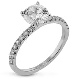 This distinctive bridal set design features a double-layer wedding band that fits around the engagement ring. The set contains .77 ctw of white diamonds.