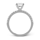 This distinctive bridal set design features a double-layer wedding band that fits around the engagement ring. The set contains .77 ctw of white diamonds.