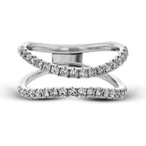 This distinctive bridal set design features a double-layer wedding band that fits around the engagement ring. The set contains .77 ctw of white diamonds.