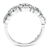 This whimsical white gold ring features .78 ctw of round white diamonds accentuated by .07 ctw of round pink diamonds as well as rose gold details in a playful floral design.