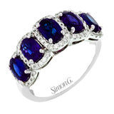 The symbol of royalty, this classic right hand ring features 2.68cttw sapphires and .29cttw diamonds set in 18K white gold.