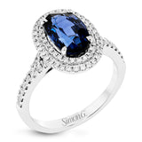 This gorgeous, vintage-inspired white gold ring features a 2.98 ctw oval shaped sapphire framed by a double halo and .42 ctw of round white diamond accents.