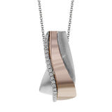 This contemporary two-tone 18k gold pendant shines with a line of .19 ctw of white diamonds in the middle.
