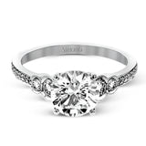 Timelessly beautiful, this white gold engagement ring's stunning design features .44 ctw of round white diamonds flanking the center stone with a lovely tapered effect.