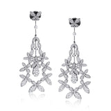 These fantastic floral drop earrings are encrusted with 3.01 ctw of stunning white diamonds.