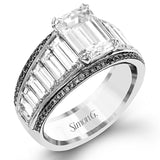 Modern and geometric, this two-tone 18k white and rose gold ring contains 2.12 ctw of white baguette diamonds as well as .20 ctw of pink diamonds.