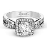 This wonderful 18k white gold ring has a distinctive design with a soft square halo and .34 ctw of white diamonds.