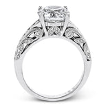 This 18k white gold engagement ring has a design taken from nature with leaves and filigree set with .43 ctw of white diamonds.
