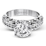 This 18k white gold engagement ring has a design taken from nature with leaves and filigree set with .43 ctw of white diamonds.